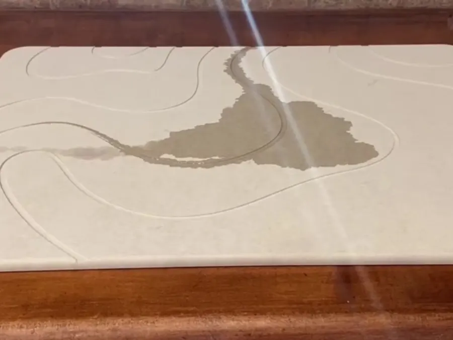 Water Soaks In, Then Disappears: ZIKIBL stone bath mat